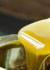 Pouring yellow contact adhesive from a tin