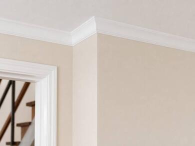 Finished room featuring decorative coving installed at the junction between the wall and ceiling for a clean and elegant finish.